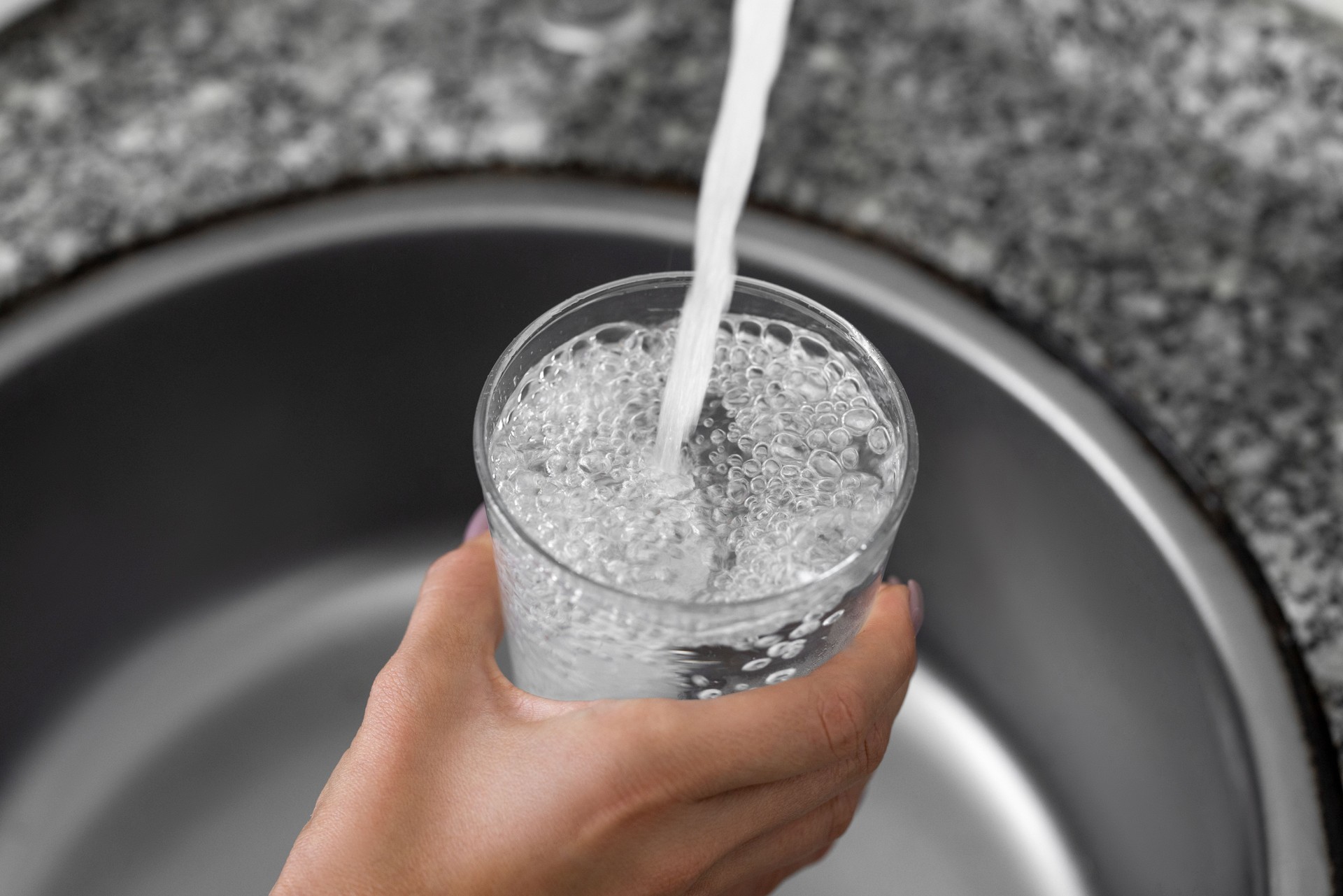 Reverse osmosis filtered water poured into glass — Chef Igor uses RO water, glass containers, and natural cleaning for food safety.